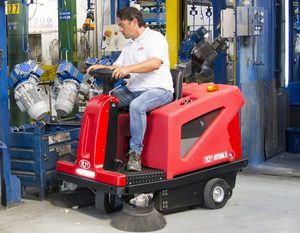 RCM Atom.3 ride-on floor sweeper cleaning a manufacturing facility